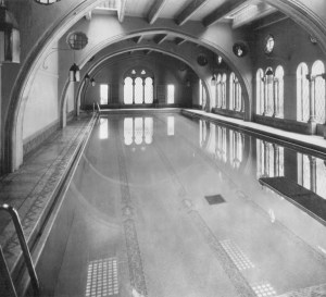 Historic photo of pool showing original placement of lanterns and reflection of skylights in pool.